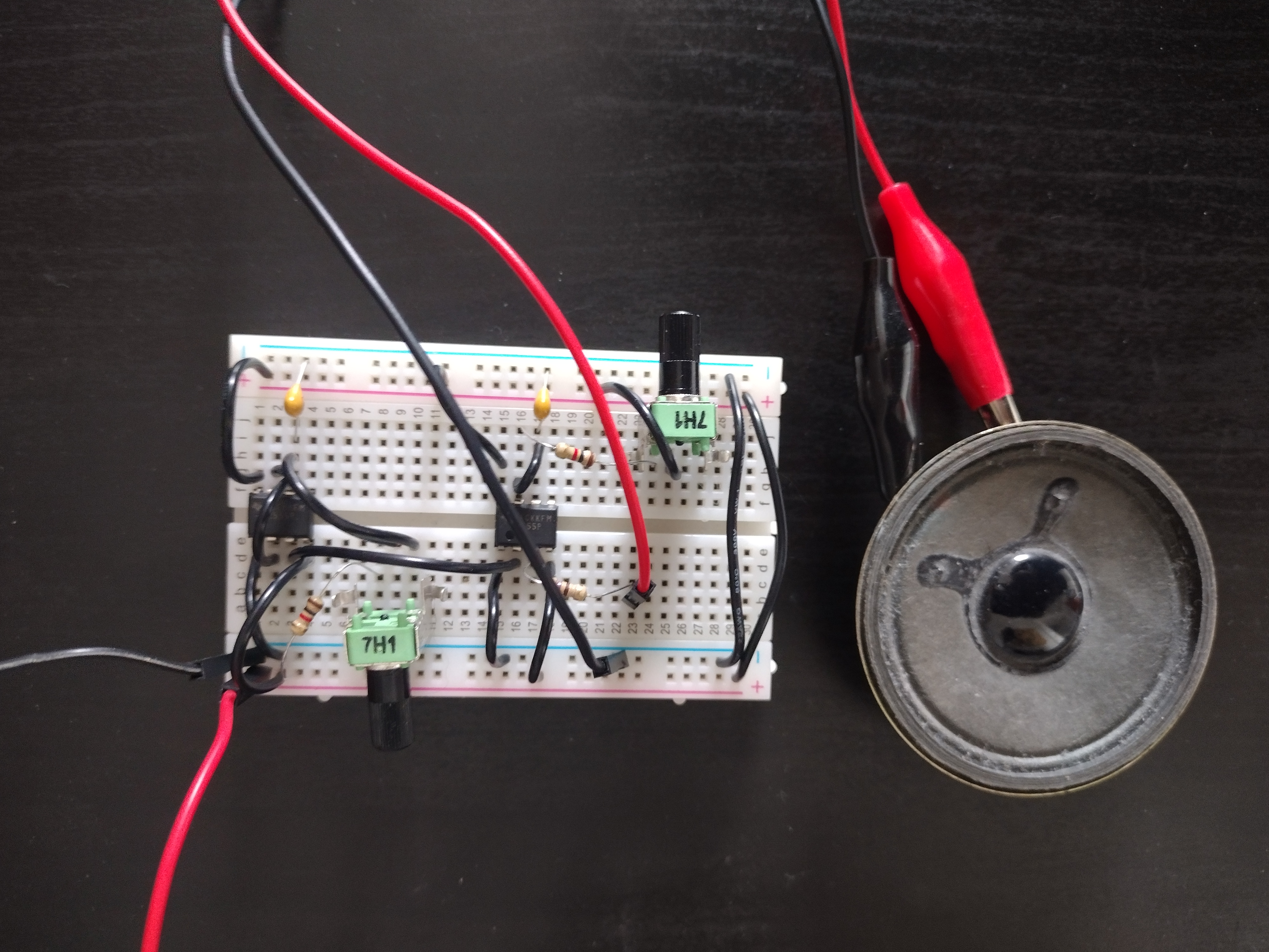 photo of a breadboard with two IC chips, wires, two potentiometers, and a few resistors and capacitors. 