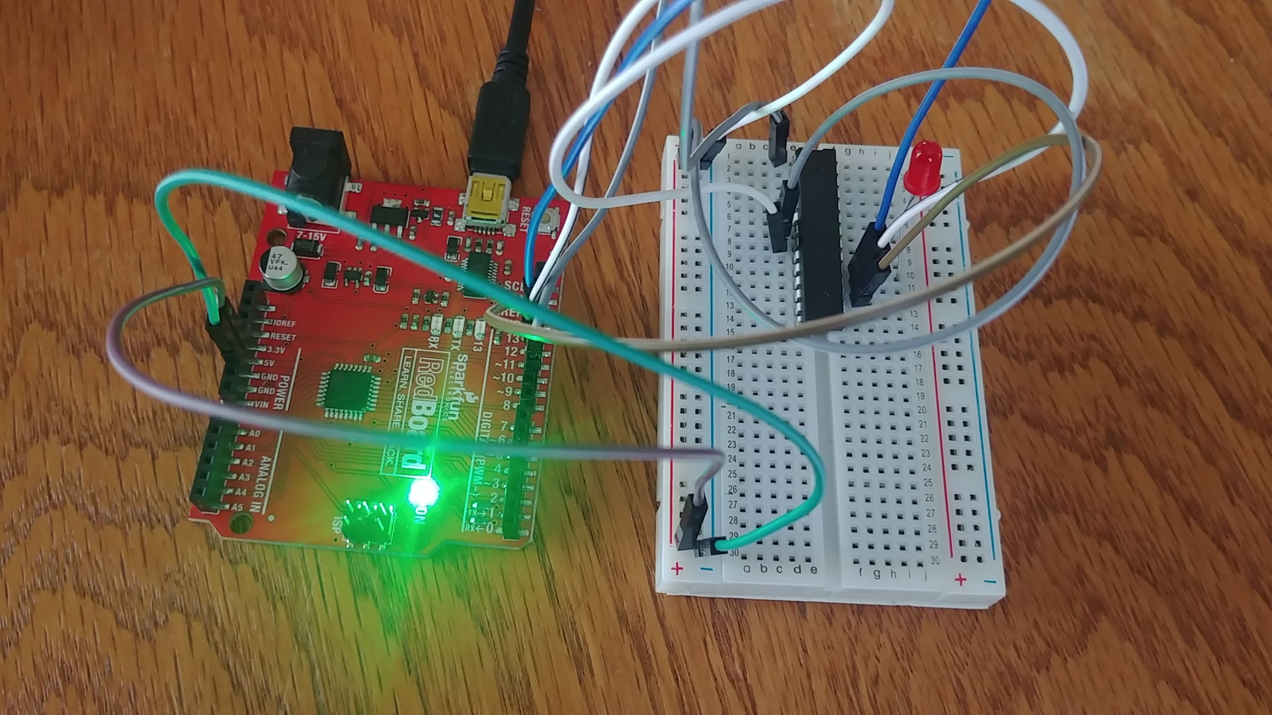 The ATmega328p wired up on the breadboard, with the ISP connected with multiple wires, following the mapping I say above